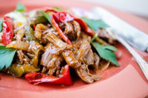 Read more about the article Braised Flank Steak with Peppers and Onions